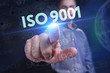 © photon_photo - The concept of business, technology, the Internet and the network. A young entrepreneur working on a virtual screen of the future and sees the inscription: ISO 9001
