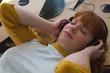 © Wavebreak Media - Woman listening music on headphones