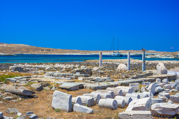Fototapete - Ancient ruins in the island of Delos in Cyclades, one of the most important mythological, historical and archaeological sites in Greece.
