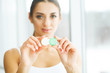 © Maksymiv Iurii - Vision And Medicine Concept. Young Girl Holds Eye Drops In Hands. Portrait of a Beautiful Woman with Contact Lenses. Healthy Look. High Resolution