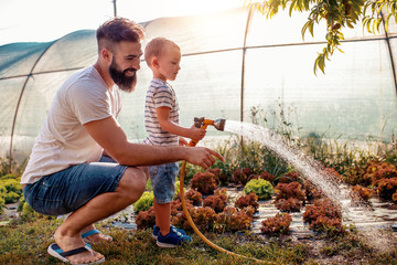 Father and son in garden