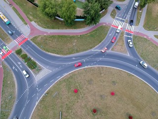 Roundabout intersection in two directions with island, aerial view