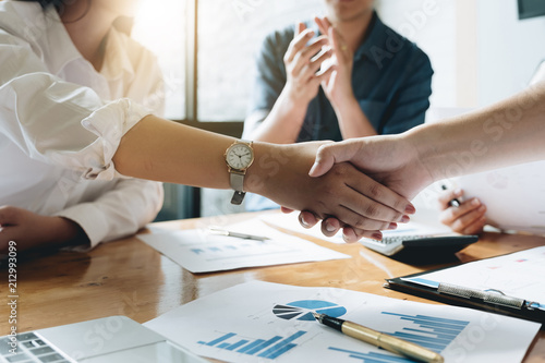 Close up of Business people shaking hands, finishing up meeting, business etiquette, congratulation, merger and acquisition concept