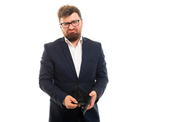Wall Mural - Portrait of business man showing empty wallet gesture.