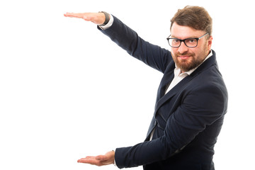 Wall Mural - Portrait of business man holding copyspace with hands gesture.