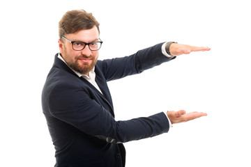 Wall Mural - Portrait of business man holding copyspace with hands gesture.