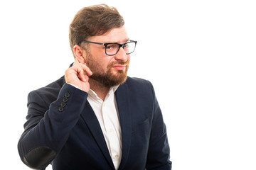 Wall Mural - Portrait of business man showing can't hear gesture.