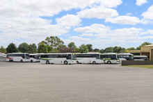 A Fleet Of Bus Coaches At A Transport Depot