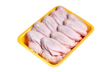 Raw And Uncooked Chicken Wings In A Yellow Plastic Container. Meat Of Poultry In Tray, Isolated On White Background. Top View