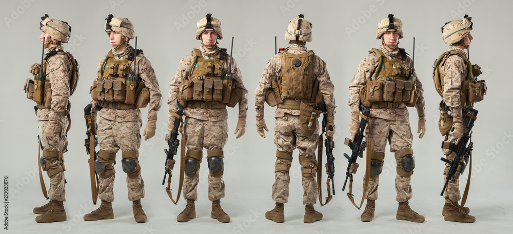 Soldier in camouflage holding rifle Stock Photo | Adobe Stock