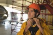 © Wavebreak Media - Male worker wearing hard hat at solar station