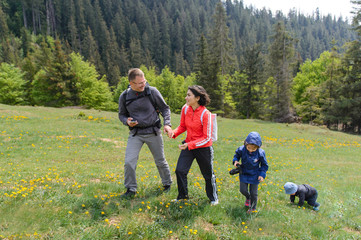 Poster - Couple with Children Walking on Meadow