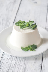 Sticker - Ricotta decorated with fresh mint on the white plate