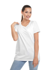 Wall Mural - Young woman in t-shirt on white background. Mockup for design