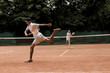 © LIGHTFIELD STUDIOS - retro styled men playing tennis at court