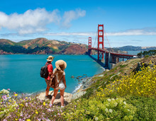 Couple Looking At Beautiful Summer Coastal Landscape, On Hiking Trip. Friends  Relaxing On Mountain. Golden Gate Bridge, Over Pacific Ocean And San Francisco Bay, San Francisco, California, USA.