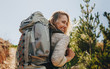 © Jacob Lund - Smiling woman going on a camping