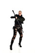 © faestock - full length portrait of blonde girl wearing black gothic outfit, holding a staff. standing pose, isolated on white studio background.