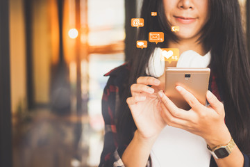 closeup of beautiful Asia woman,teen,girl using mobile phone  working with many icons double exposure.