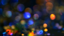 Defocused Shimmering Multicolored Glitter Confetti, Black Background. Party, Magic, Imagination. Rainbow Colors, Sparkle Circles. Holiday Abstract Festive Texture Of Shiny Blurred Bokeh Light Spots.