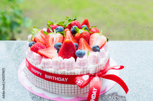 Fresh Big Strawberry And Blueberry Topping Decorated On Pink