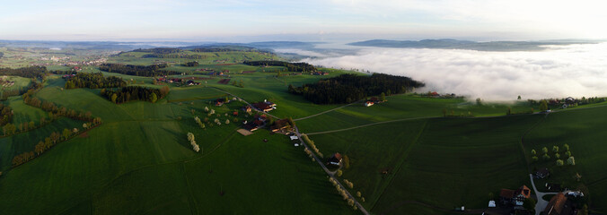 Wall Mural - Panorama aerial view of the hilly landscape in central Switzerland on a beautiful spring morning