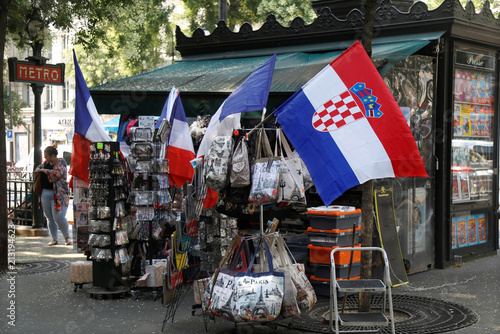 A Croatian Flag And French Flags On Sale Fly On A Kiosk In