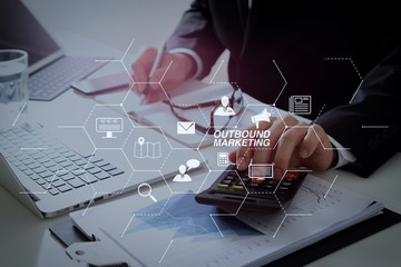 Poster - businessman hand working with finances about cost and calculator and latop with mobile phone on withe desk in modern office