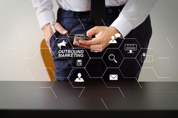 Poster - close up of businessman working with smart phone on wooden desk in modern office