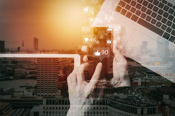 Poster - cyber security internet and networking concept.Businessman hand working with VR screen padlock icon mobile phone on laptop computer with building exposure
