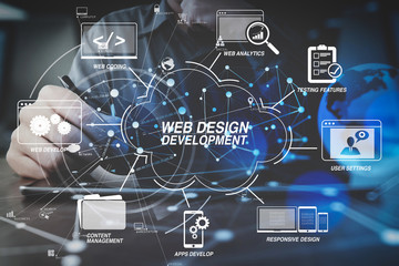 businessman hand working with modern digital tablet computer in modern office with virtual icon diagram