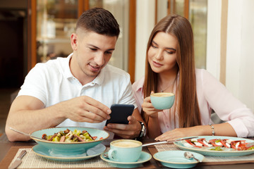 Wall Mural - Two people in cafe enjoying the time spending with each other