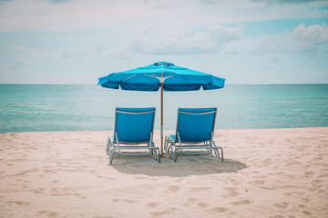 Wall Mural - Two beach chairs on tropical vacation