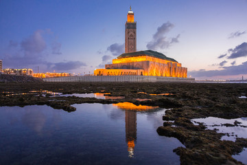 view of Hassan II mosque view of Hassan II mosque reflected on water - Casablanca - Morocco on water - Casablanca - Morocco