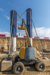 Wall Mural - Construction of the pillars of a bridge with a lifting platform.