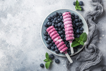 Poster - homemade blueberry popsicles with fresh berries