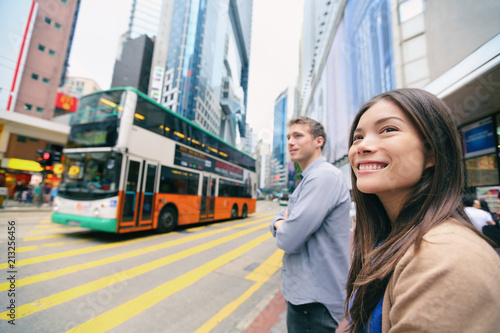 Fotografie, Tablou Hong Kong People walking waiting for traffic lights to cross busy road with double decker bus