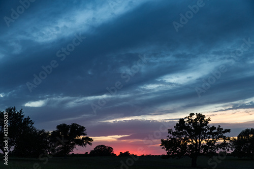 Purple Pink And Blue Sunset With Landscape Buy This Stock