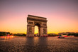 Arch of triumph at twilight. Arc de Triomphe at end of Champs Elysees in Place Charles de Gaulle with cars and trails of lights. Popular landmark and tourist attraction in Paris capital of France.