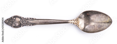 Fotografía Top view of old silver tea spoon isolated on white