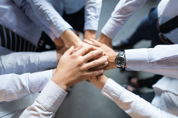 Fototapete - Stack of hands. Unity and teamwork concept.