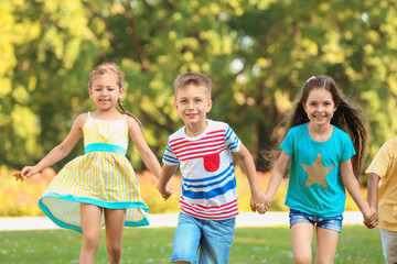 Wall Mural - Cute little children playing in park