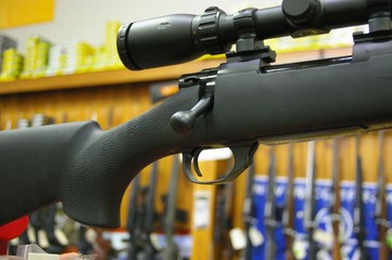 Guns, Firearms and hunting Rifles on display to be sold at a gun shop in a rural farming community in New South Wales, Australia