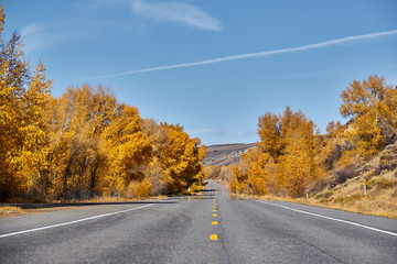 Highway at autumn in Colorado, USA.