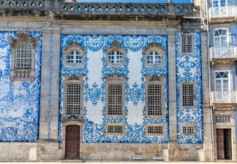 Traditional historic church facade in Porto decorated with blue hand painted tin-glazed tiles, Oporto, Portugal