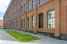 Office Building In Loft Style. Large Windows. Red Brick Wall.