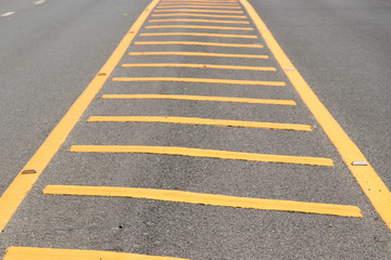 Yellow color road line on asphalt background