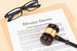 © wirojsid - Wooden judge gavel and divorce decree; document is mock-up