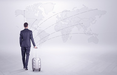 Businessman in dark suit planning his trip in a front of a map
