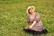 © st_fox - woman is sitting on a meadow